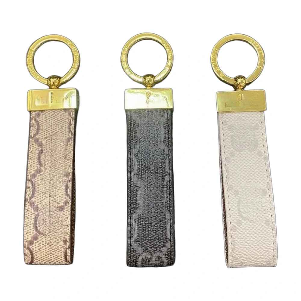 Gucci GG Supreme Monogram Leather Keychain